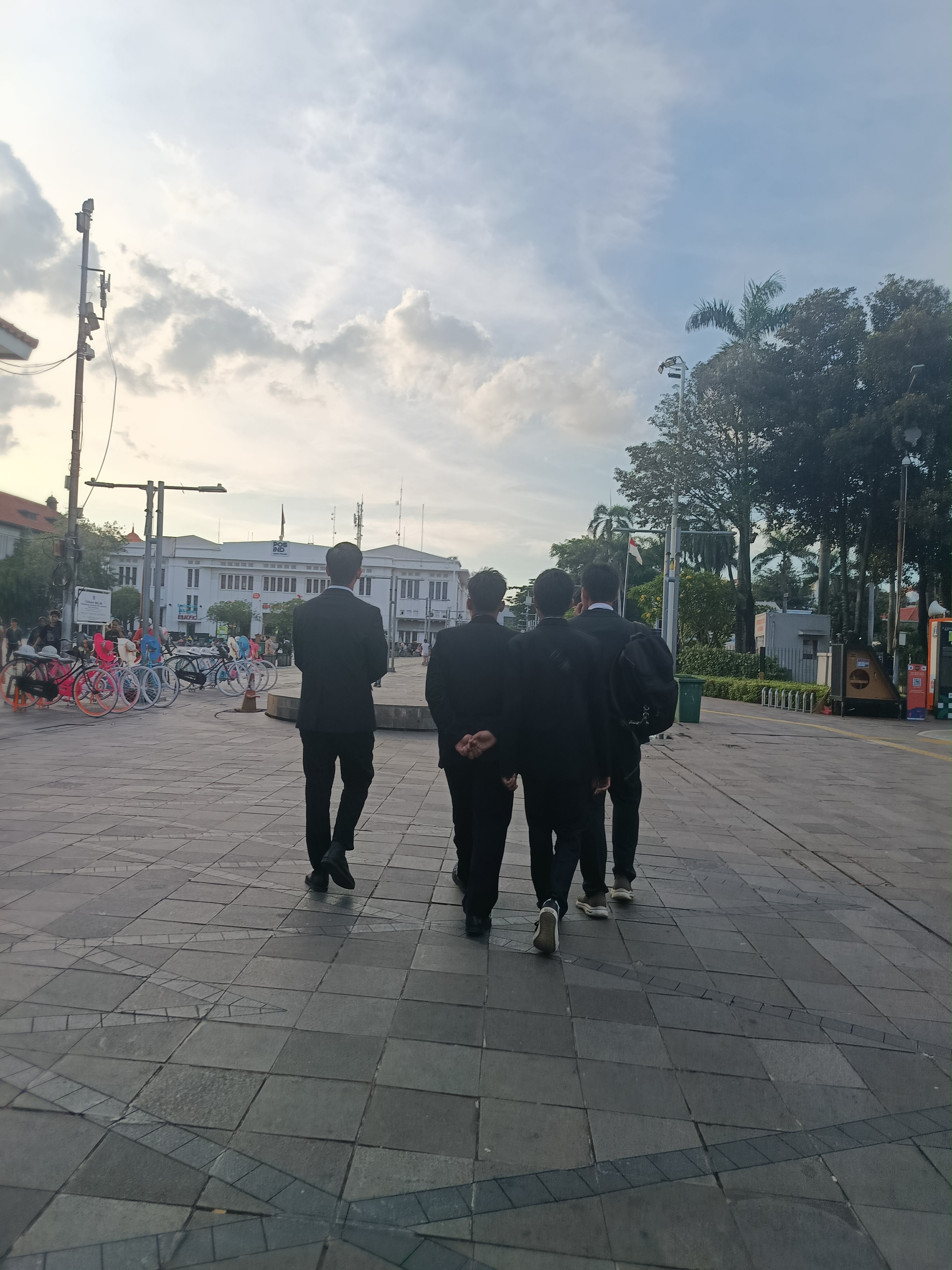 Friends walking around Kota Tua after graduation