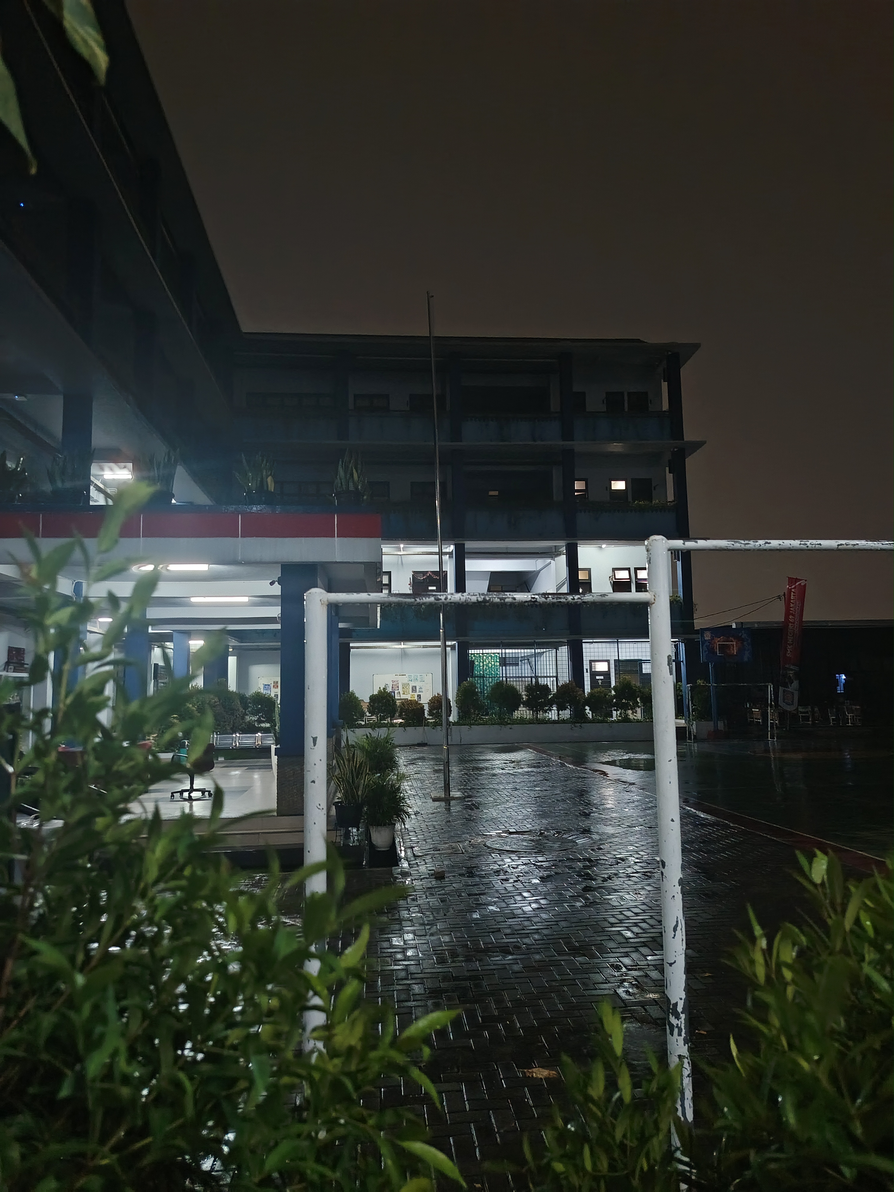 A school building at night after rain