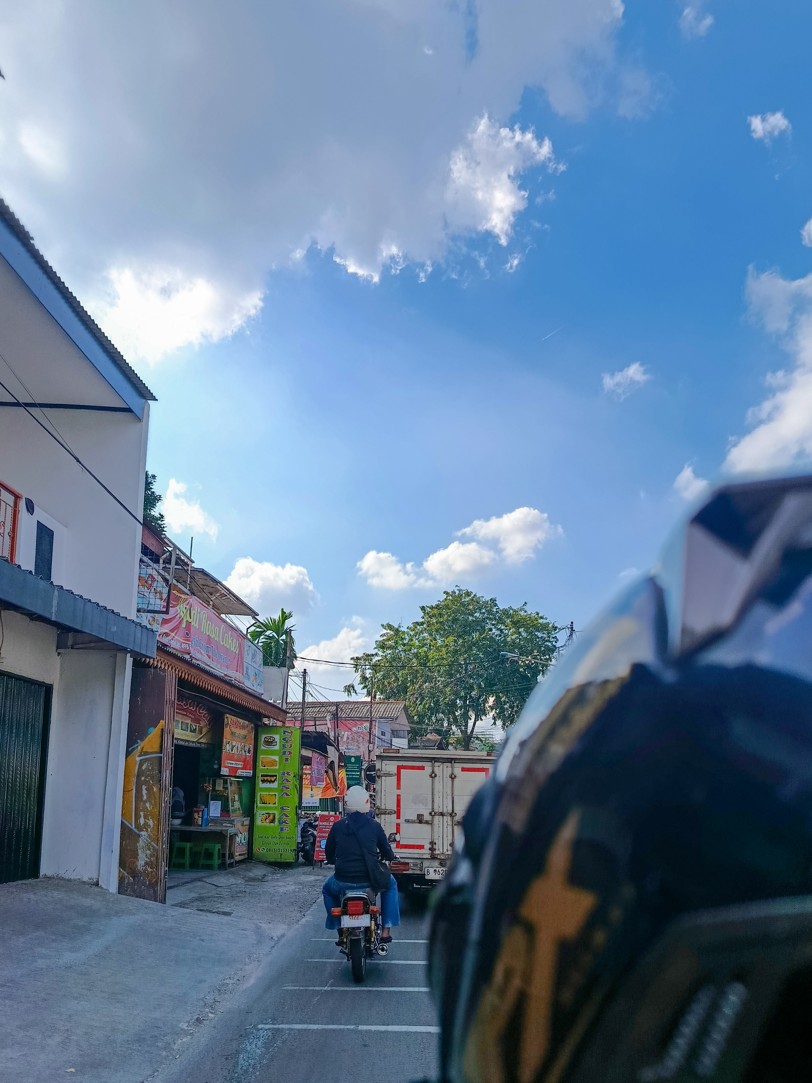 A road view while riding with a friend under a clear sky