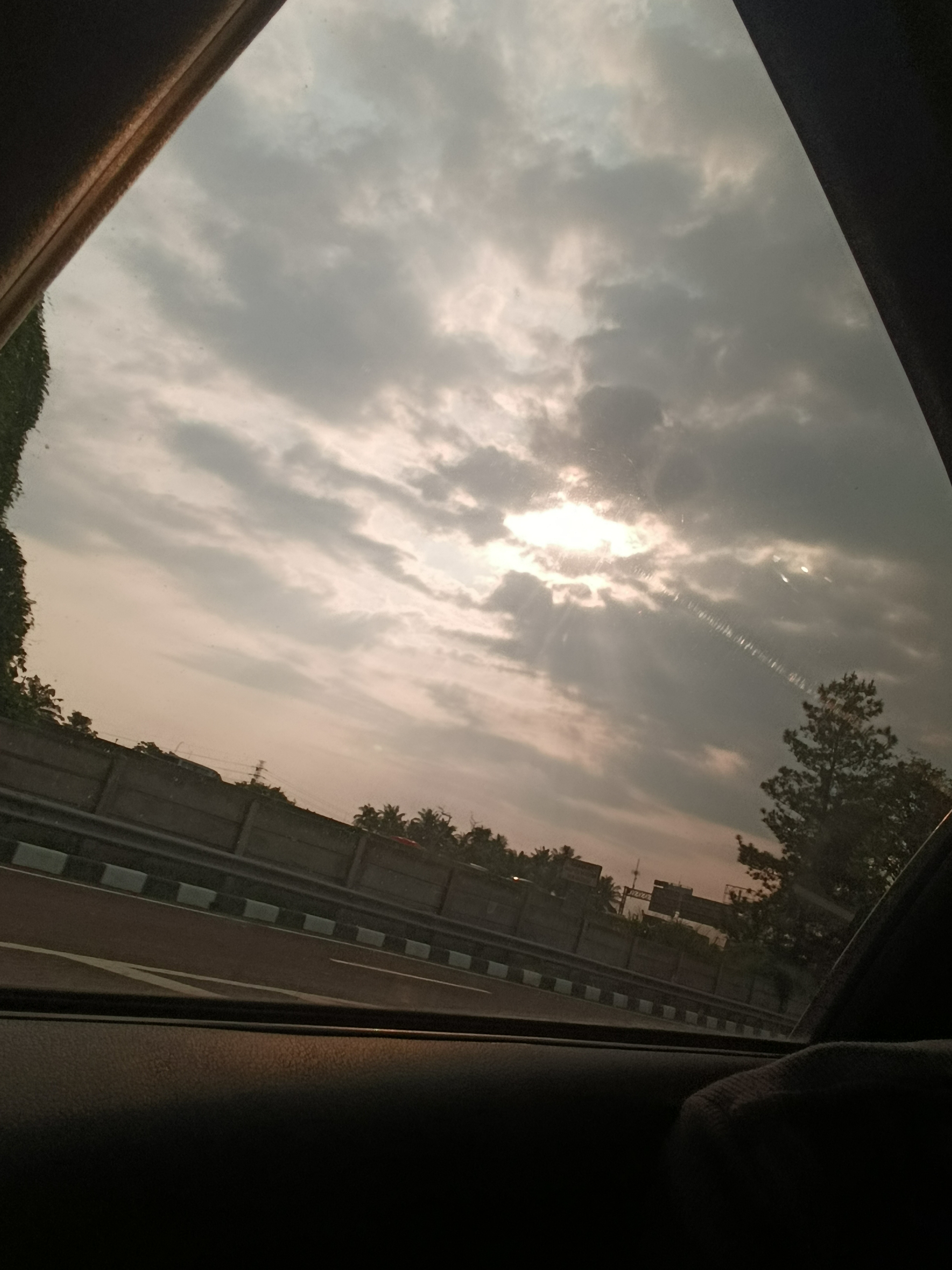 An evening sky photographed from inside a car after a client visit