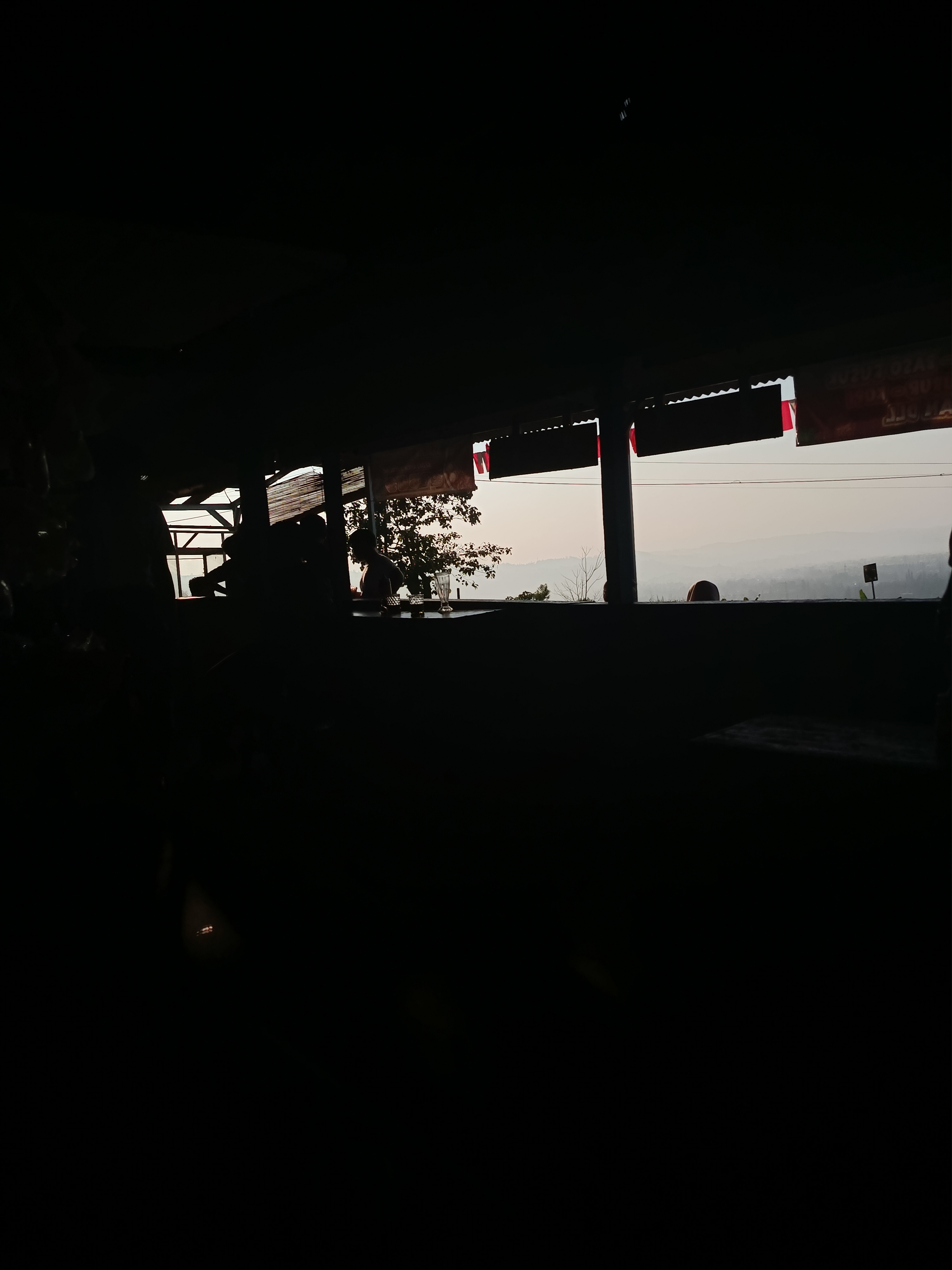 A dark interior view from a food stall before breakfast