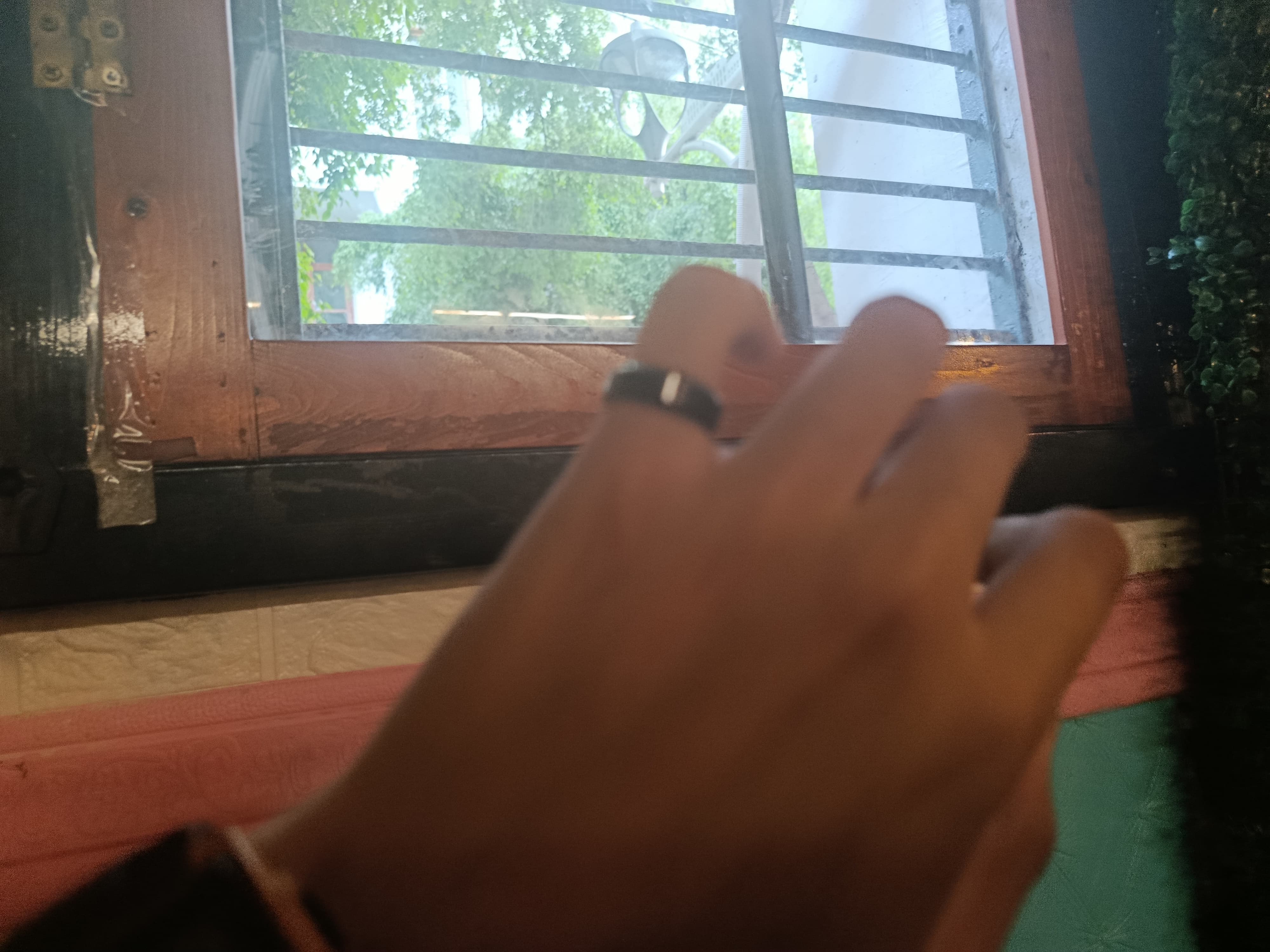 A ring on a hand at a restaurant near Kota Tua