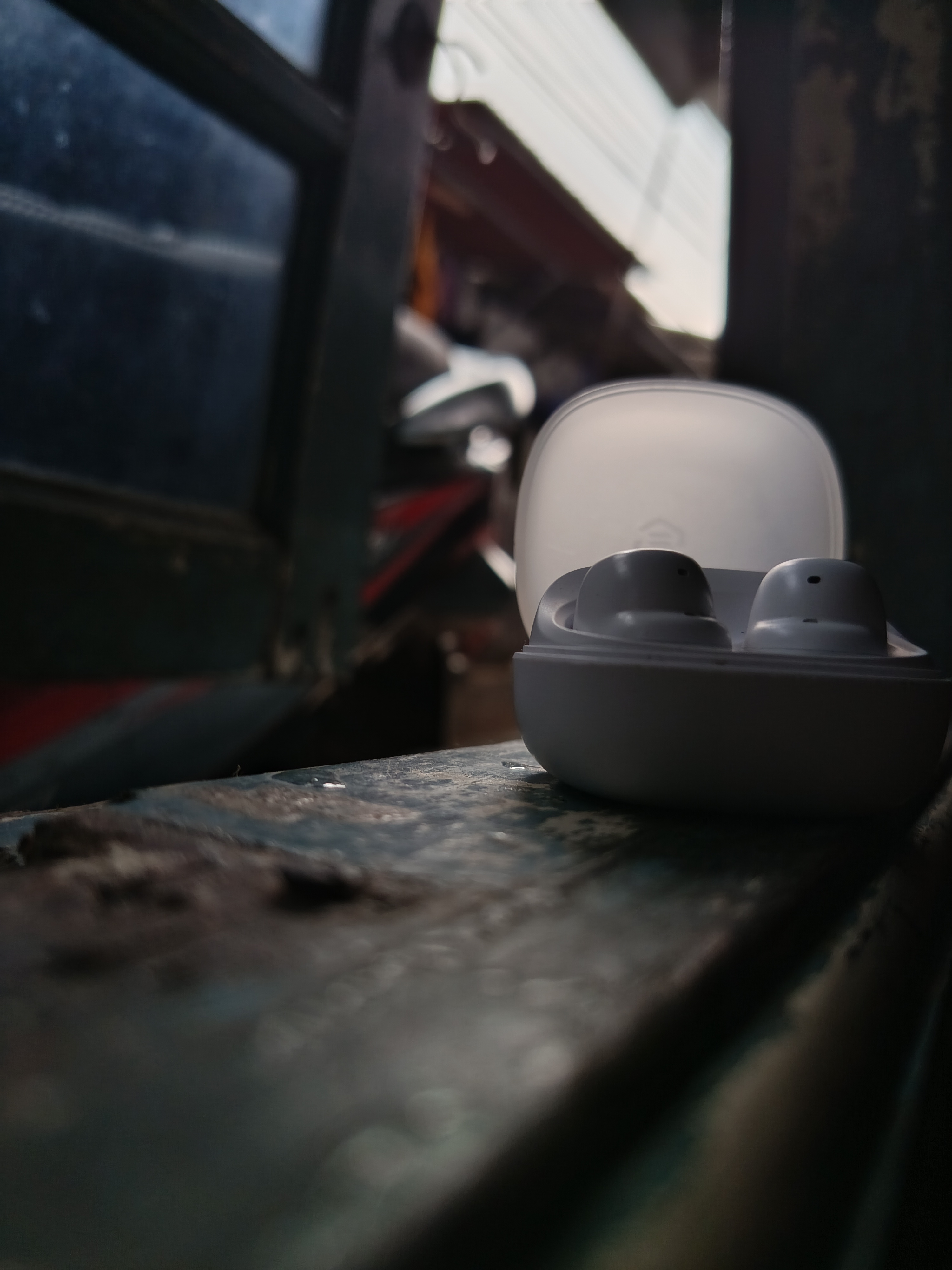 Earphones near a home window in the afternoon